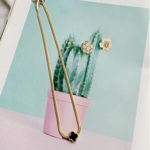 Elegant Gold Necklace with Black Pendant